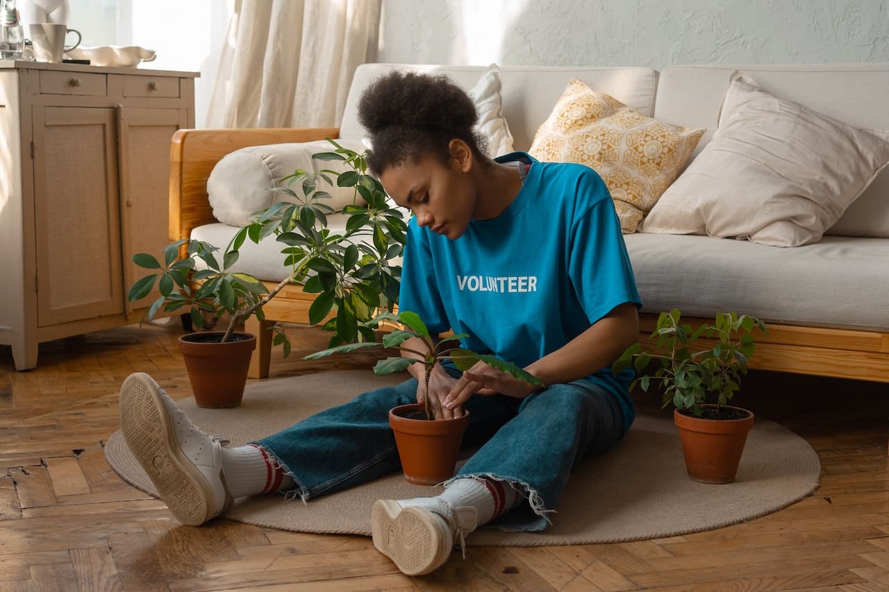 woman making potted plants for a home